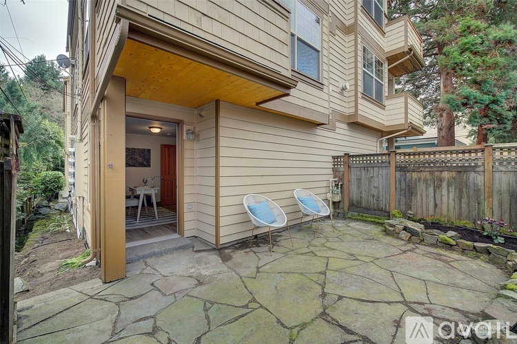 A house with a patio and a hot tub.