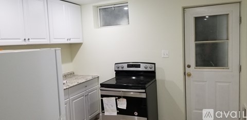 A kitchen with a stove and a refrigerator.