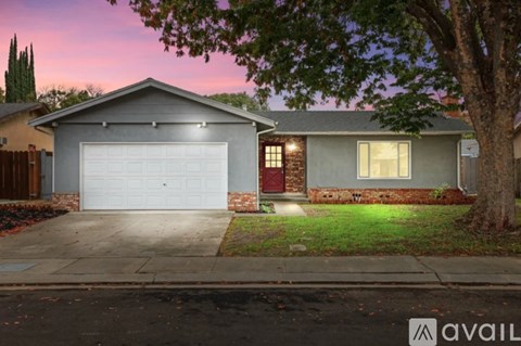 A house with a garage is available for sale.