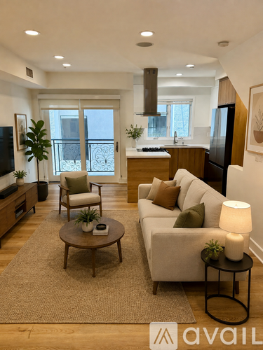 A living room with a couch, chair, and a television.