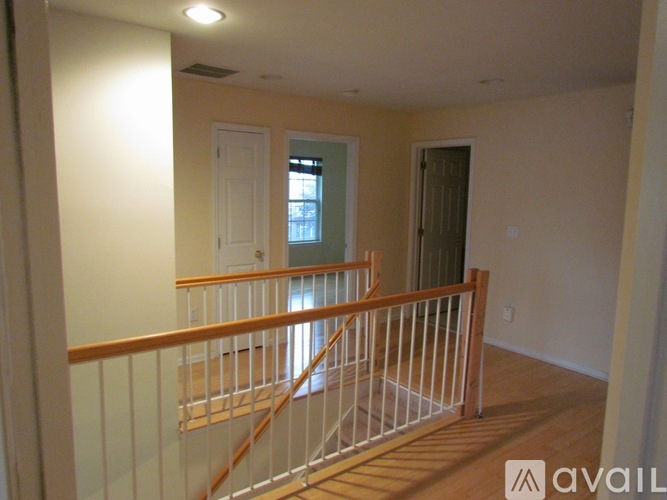 A room with a staircase and a window.