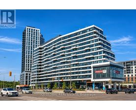 A modern multi-story building with a glass facade is the main focus of the image.