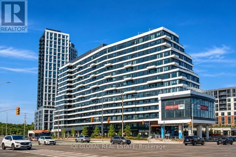 A modern multi-story building with a glass facade is the main focus of the image.