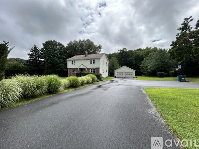 A house with a driveway in front of it.