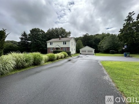 A house with a driveway in front of it.