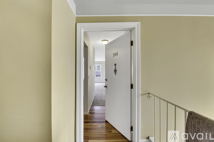 A hallway with a door numbered 204.