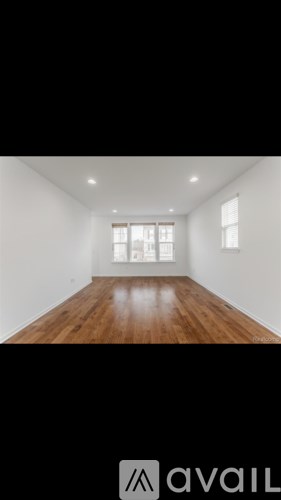 A room with wooden floors and white walls.