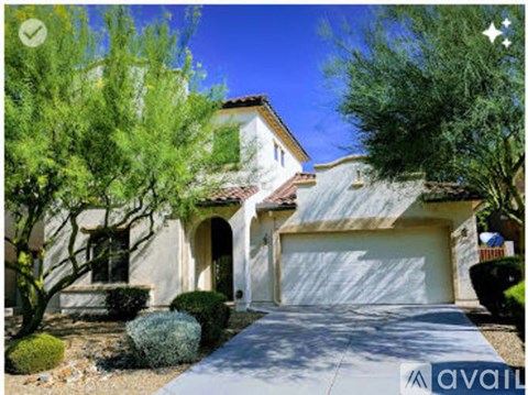 A house with a white garage door is for sale.