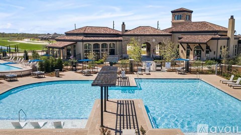 A large house with a pool in front of it.