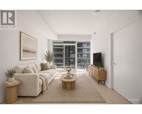 A living room with a large window and a flat screen TV.