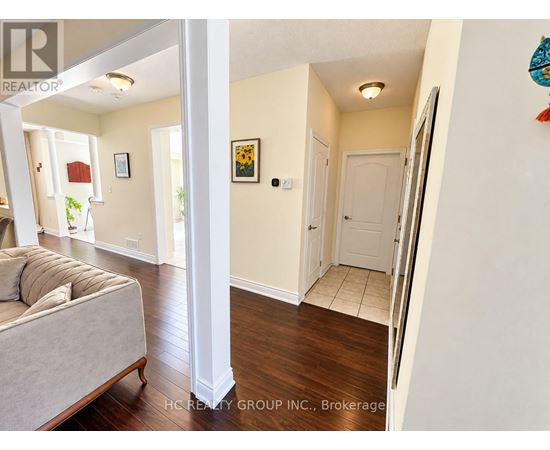 A living room with a couch and a white door.
