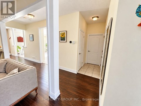 A living room with a couch and a white door.