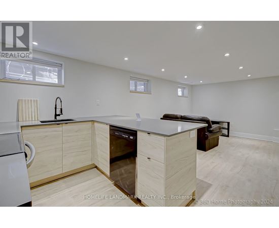 A modern kitchen with wooden cabinets and a dishwasher.