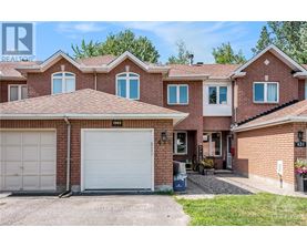 A house with a white garage door is for sale.