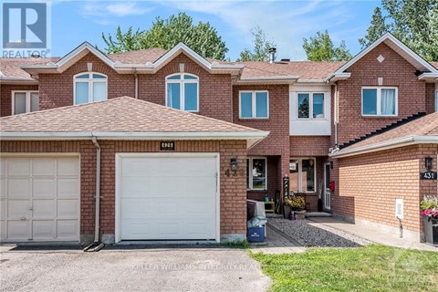 A house with a white garage door is for sale.