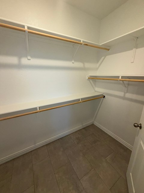 Empty white shelves in a room.
