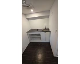 A small bathroom with a sink and toilet.
