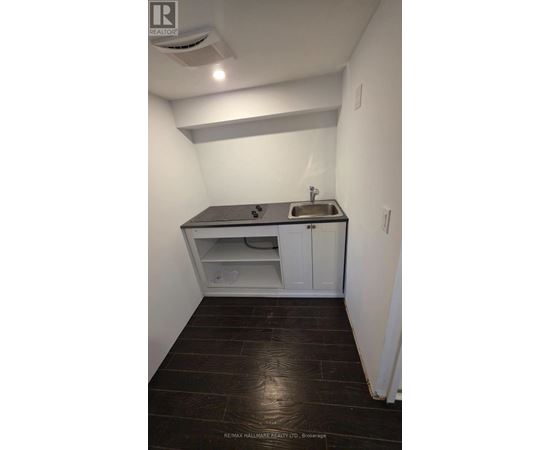 A small bathroom with a sink and toilet.