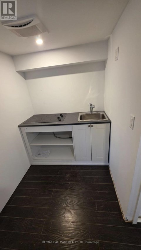 A small bathroom with a sink and toilet.