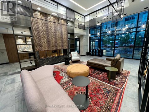 A modern living room with a large sofa and a rug.