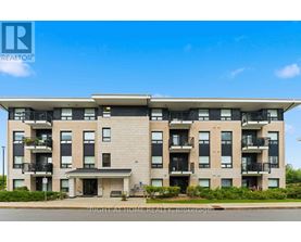A large apartment building with a balcony on the second floor.