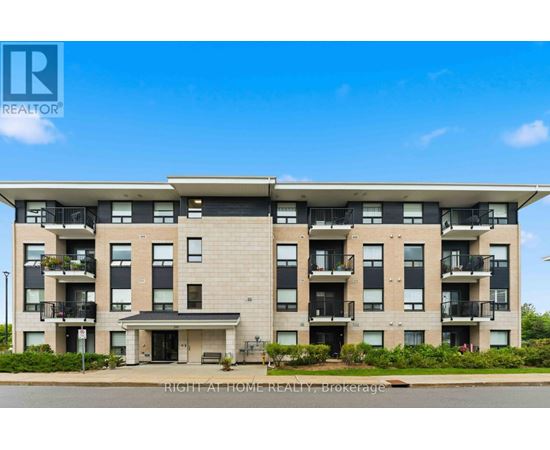 A large apartment building with a balcony on the second floor.