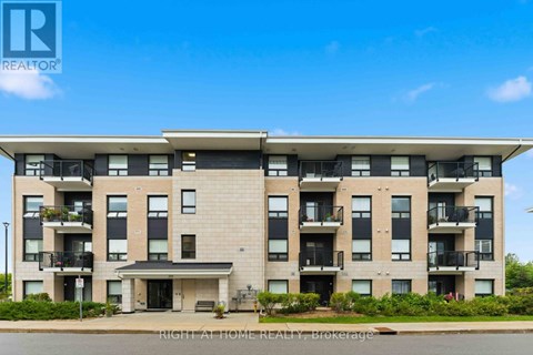 A large apartment building with a balcony on the second floor.