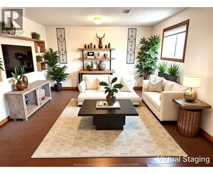 A living room with a white couch and a coffee table in the center.