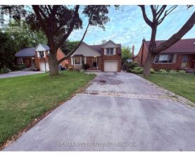 A house with a driveway in front of it.
