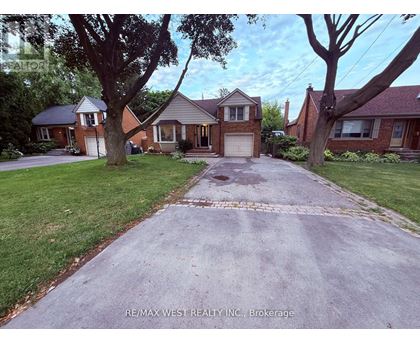 A house with a driveway in front of it.