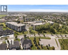 A bird's eye view of a residential area with houses and apartment buildings.