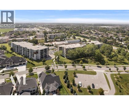 A bird's eye view of a residential area with houses and apartment buildings.