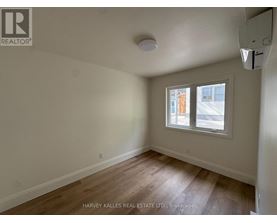 A room with a window showing an outdoor view.