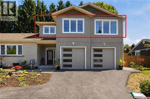 A house with a grey front and a red rectangle drawn on it.