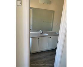 A bathroom with a sink and a mirror.