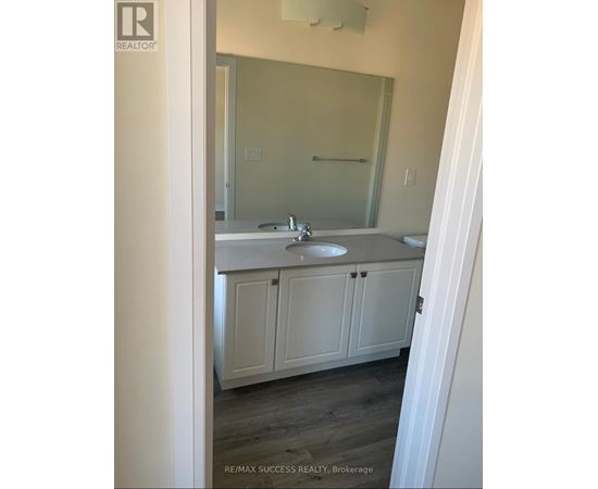 A bathroom with a sink and a mirror.