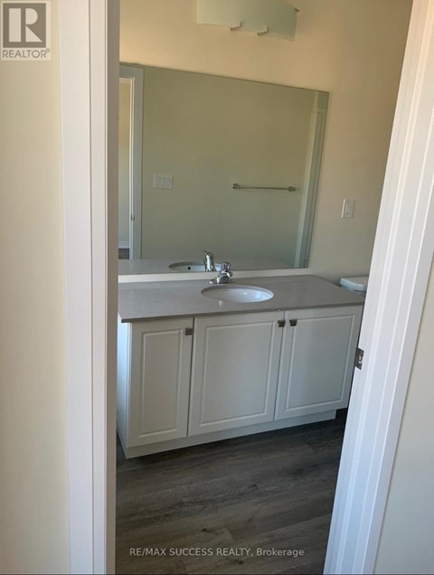 A bathroom with a sink and a mirror.