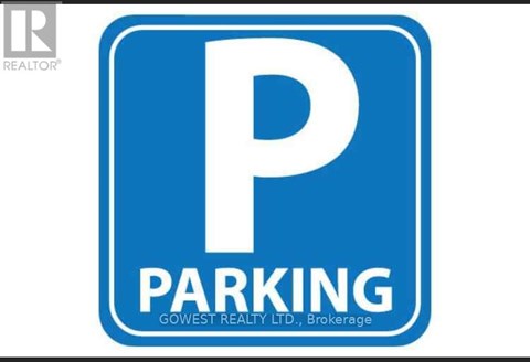 A blue and white parking sign with the word "PARKING" on it.