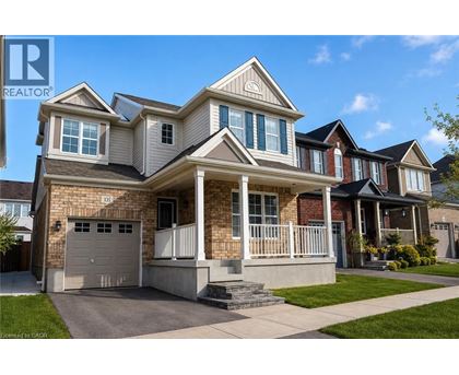 A large house with a garage is for sale.