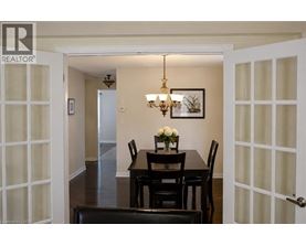 A dining room with a table set for two.