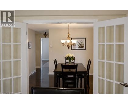 A dining room with a table set for two.