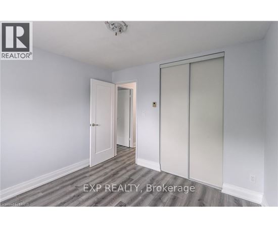 A room with a sliding door and a ceiling fan.