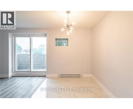 A room with EXP REALTY, Brokerage logo on the wall.