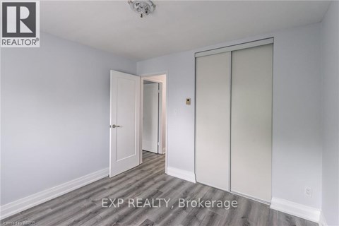 A room with a sliding door and a ceiling fan.