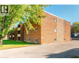 A brick building with trees in front of it.