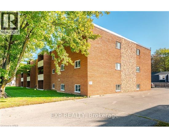 A brick building with trees in front of it.