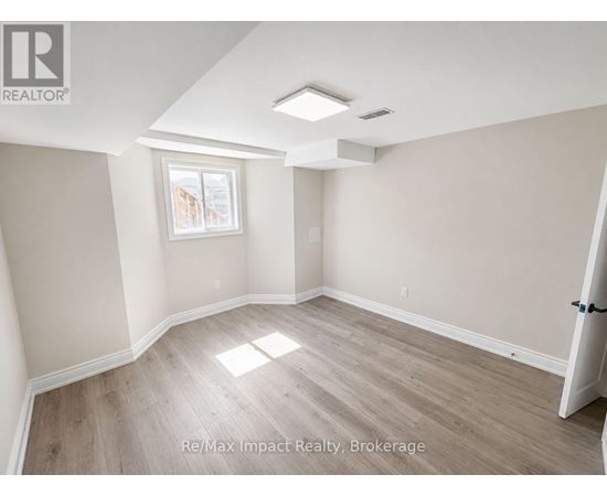 A room with a window and a door is for rent.