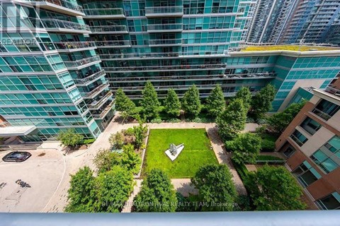 A green space surrounded by buildings.