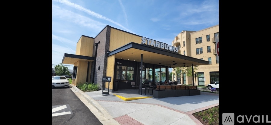A Starbucks coffee shop with a yellow and black exterior.