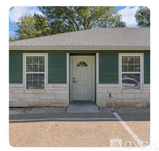 A small house with a white door and windows.